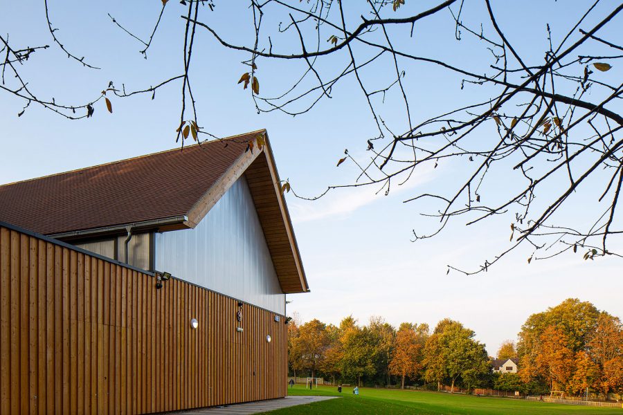 The design of new facilities including hall and changing facilities on a sloping site within an existing park setting.