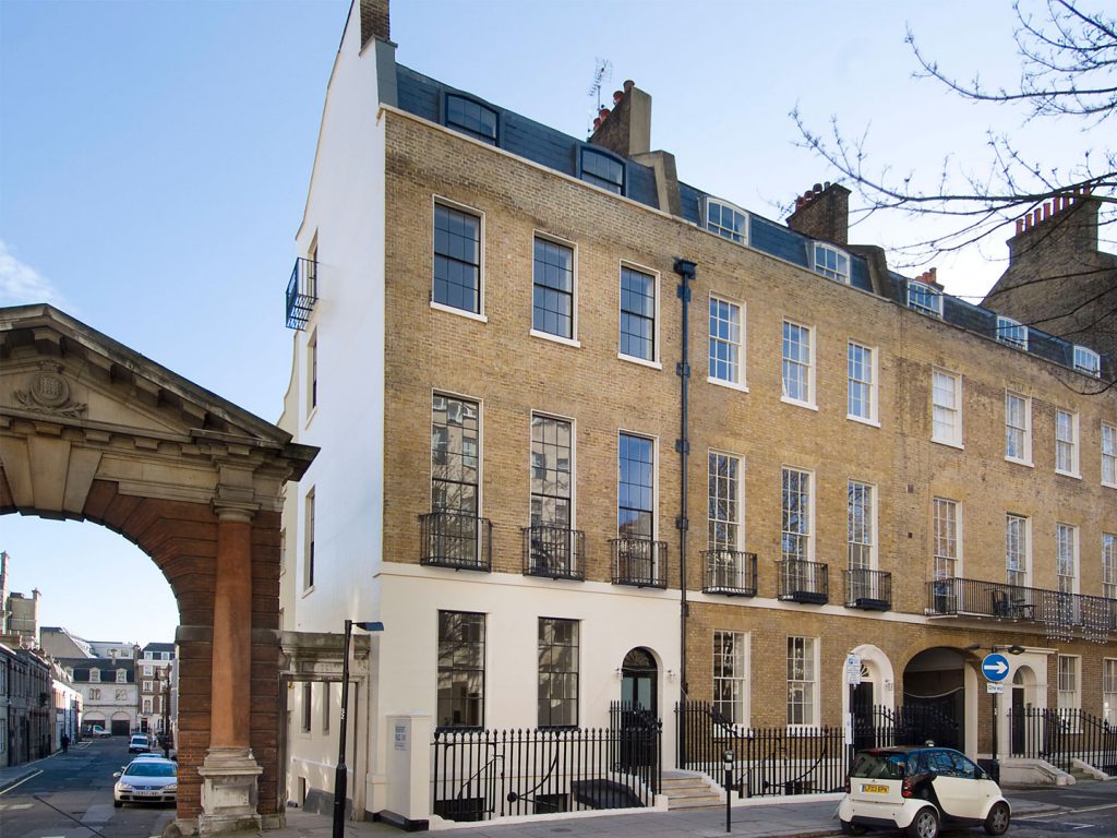 The central design challenge was the creation of five contemporary lateral apartments within the historic fabric of two Grade II listed Georgian town houses. Working with English Heritage and Westminster City Council conservation officers, design solutions were developed that included a stone clad double height glazed extension to the rear and unique walnut-clad bathroom pods.