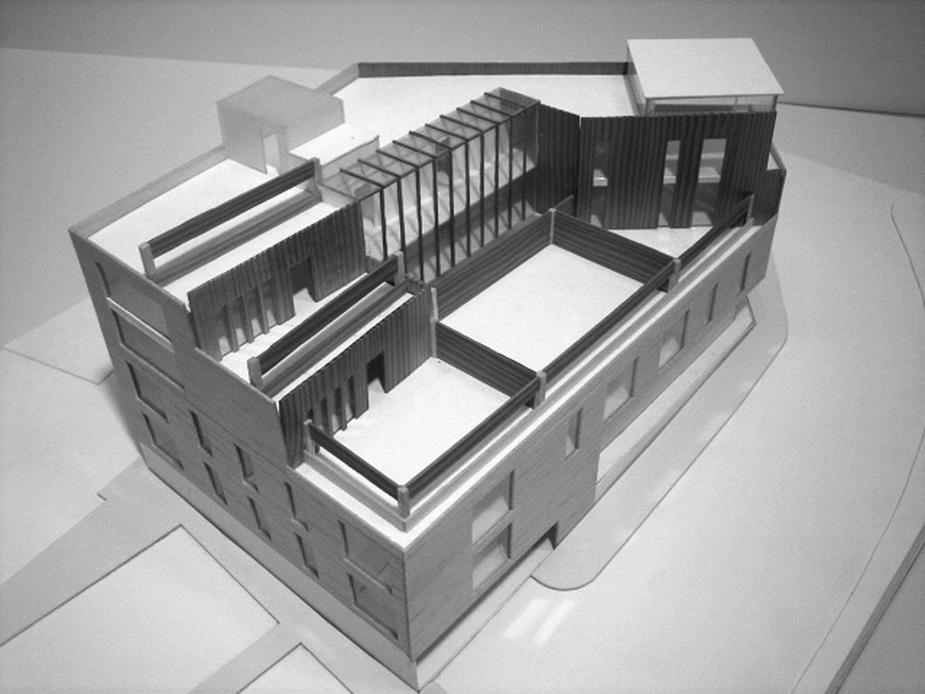 The design of a residential block providing 14 apartments and 2500 sq ft of retail accommodation on a sloping site in Wandsworth.